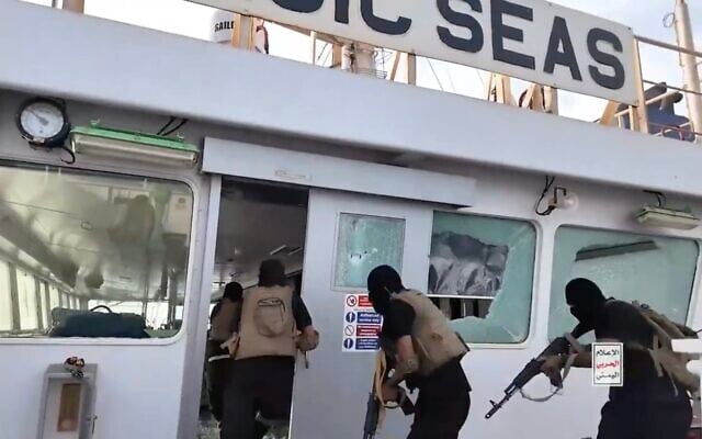 Screen capture from video of Houthi gunmen storming the bridge of the Iberian-flagged cargo ship Magic Seas before they sank it July 8, 2025. (Houthi Media Office)